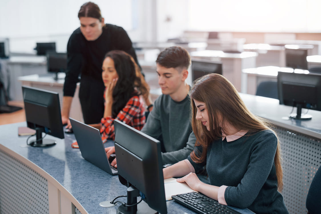 Students in a school’s computer lab using computers.